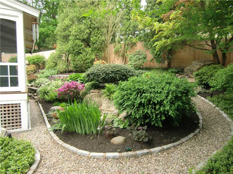 2 Revere Road Riverside, CT 06878 - Photo 4 of 13 a view of a garden with plants and large trees