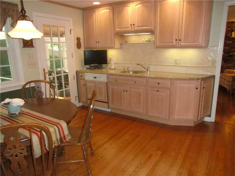 2 Revere Road Riverside, CT 06878 - Photo 7 of 13 a kitchen with sink cabinets and dining table