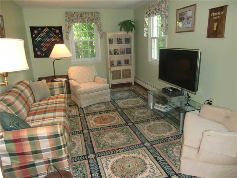 2 Revere Road Riverside, CT 06878 - Photo 8 of 13 a living room with furniture and a flat screen tv