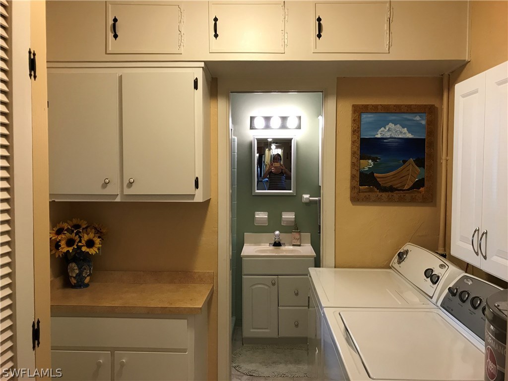 1439 Collins Road Fort Myers, FL 33919 - Photo 16 of 20 a utility room with a sink dryer and washer