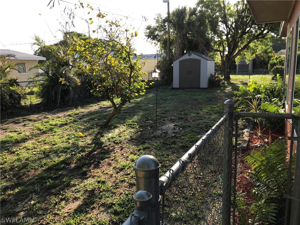 1439 Collins Road Fort Myers, FL 33919 - Photo 20 of 20 a front view of a house with garden