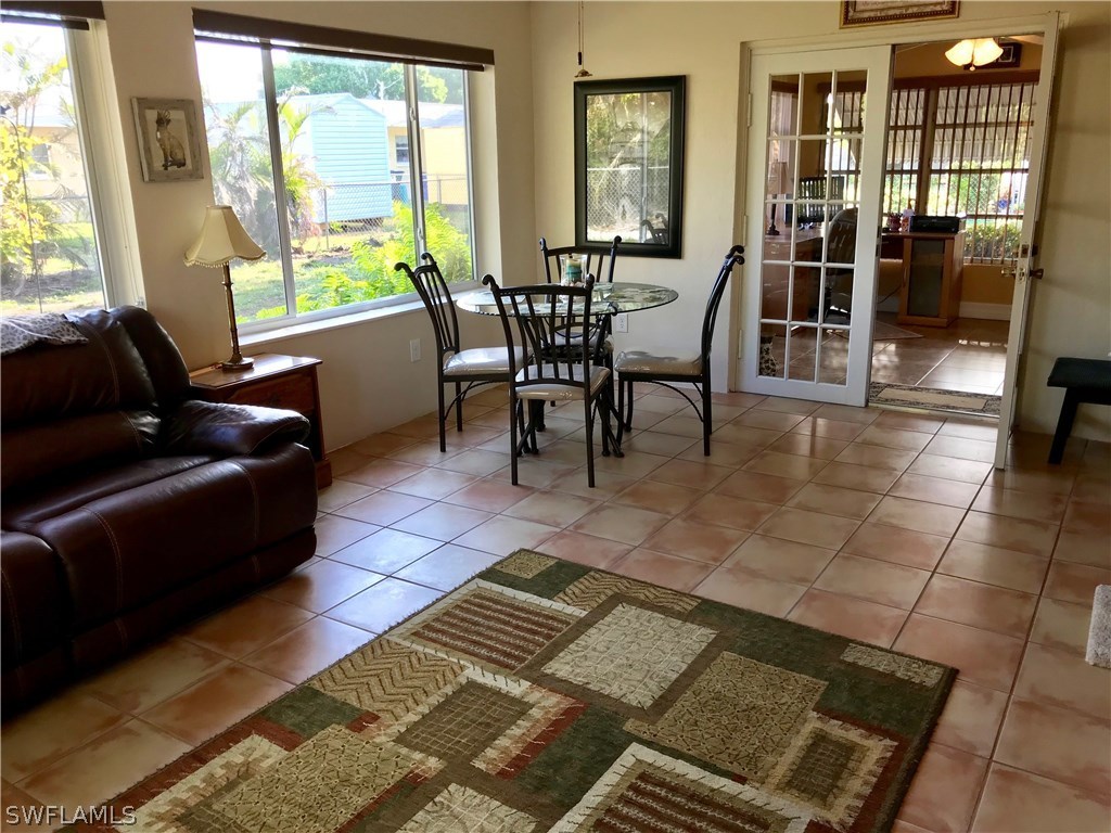 1439 Collins Road Fort Myers, FL 33919 - Photo 4 of 20 a view of a dining room with furniture