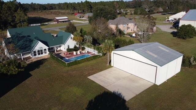 1510 Vinson Ray Road Baker, FL 32531 - Photo 49 of 60 an aerial view of a house with a garden and lake view