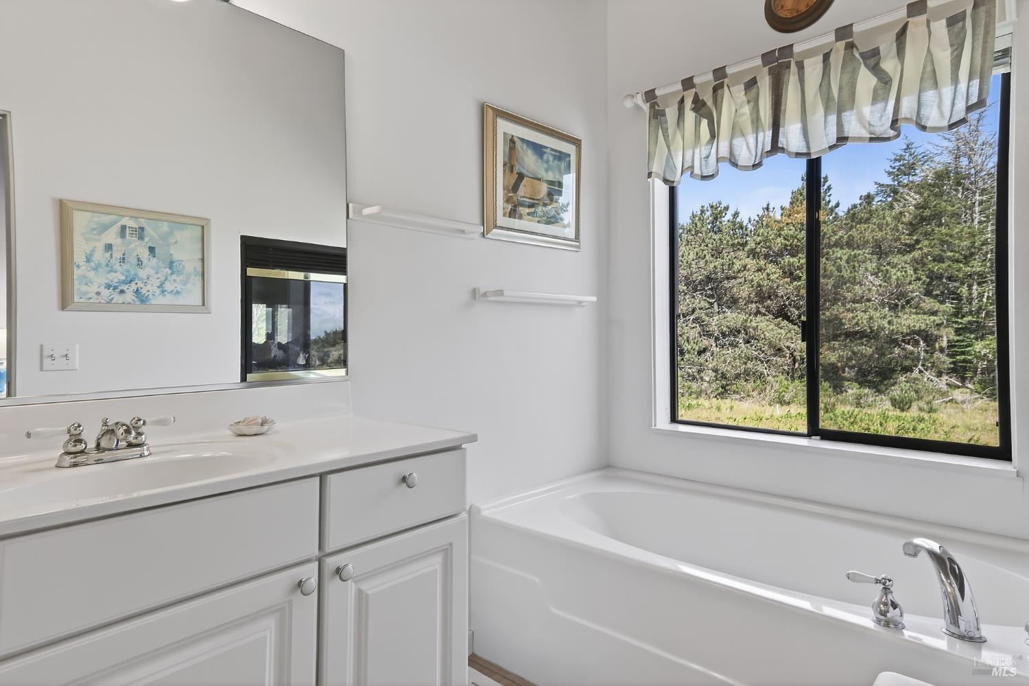 41339 Westwind The Sea Ranch, CA 95497 - Photo 30 of 60 Soaking tub with window in primary bathroom