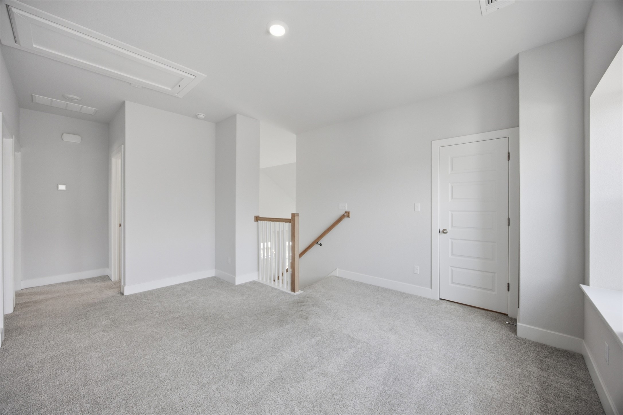 2101 Little Snake Way Georgetown, TX 78633 - Photo 25 of 37 A spacious secondary living area features soft carpeting and natural wood handrails.