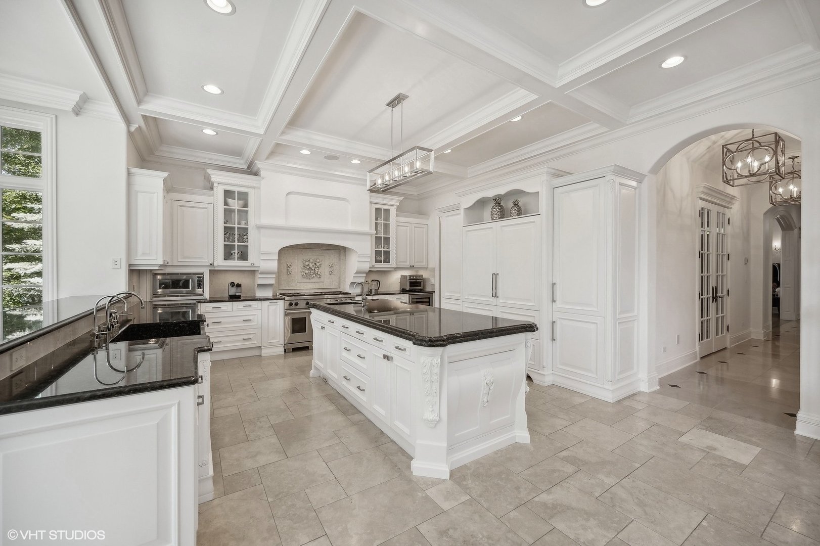 67 Beach Road Glencoe, IL 60022 - Photo 15 of 43 a kitchen with granite countertop a sink stainless steel appliances and cabinets