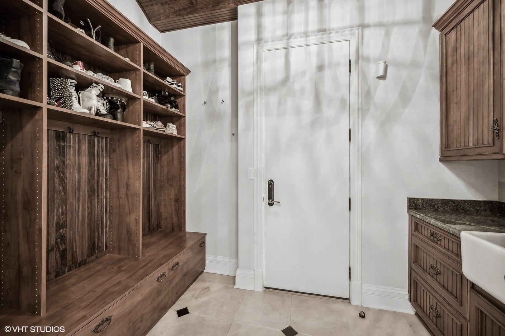 67 Beach Road Glencoe, IL 60022 - Photo 19 of 43 a view of wooden floor and cabinets in a kitchen
