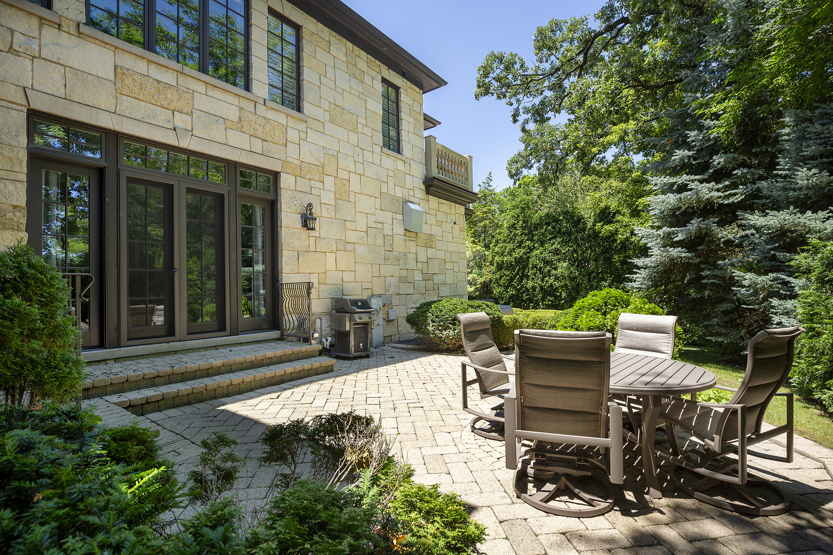 67 Beach Road Glencoe, IL 60022 - Photo 38 of 43 a view of a patio with table and chairs and potted plants