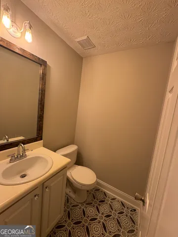 a bathroom with a sink and toilet