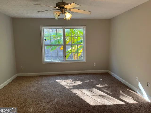 en empty room with windows