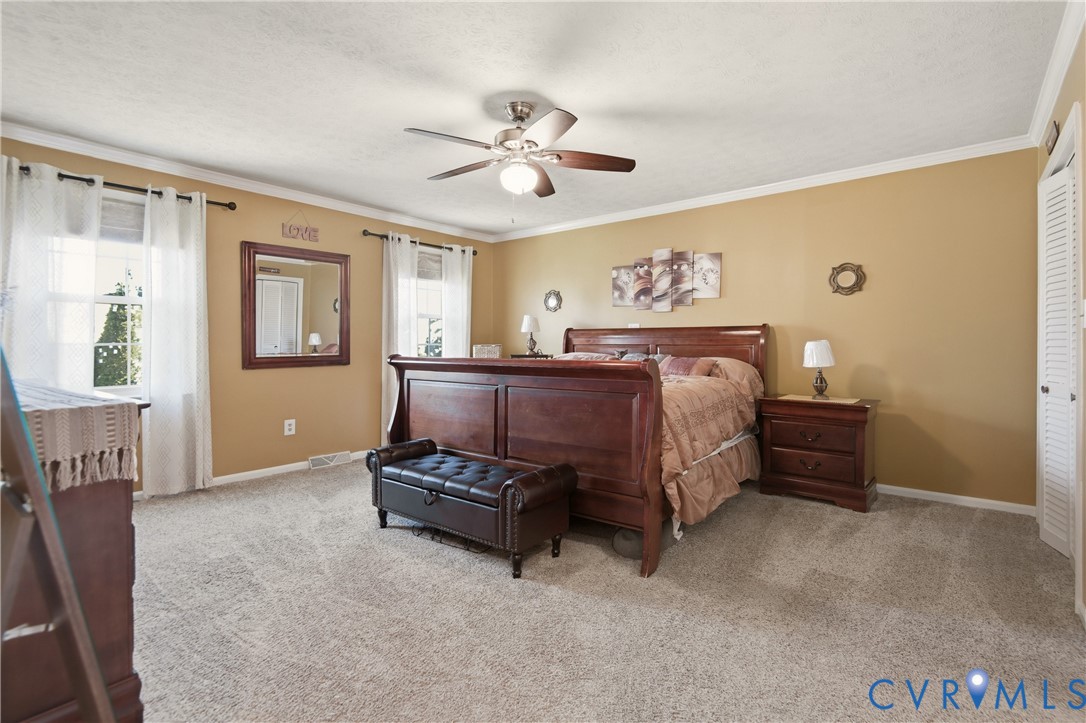 107 Oxford Road Hopewell, VA 23860 - Photo 37 of 50 Plush carpeting throughout, ceiling fan with integ