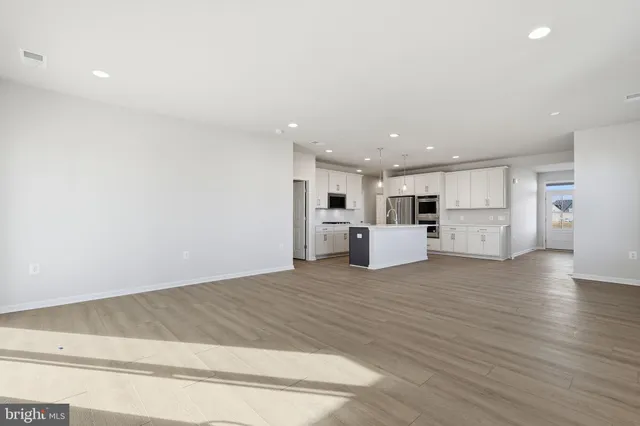 a view of kitchen with wooden floor