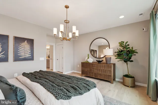 a bedroom with bed and a window