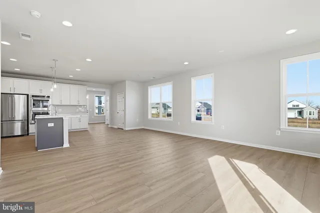 a view of kitchen with cabinets and wooden floor