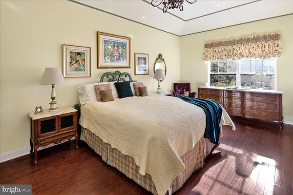 a bed room with a bed and a window