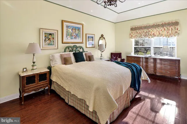 a bed room with a bed and a window