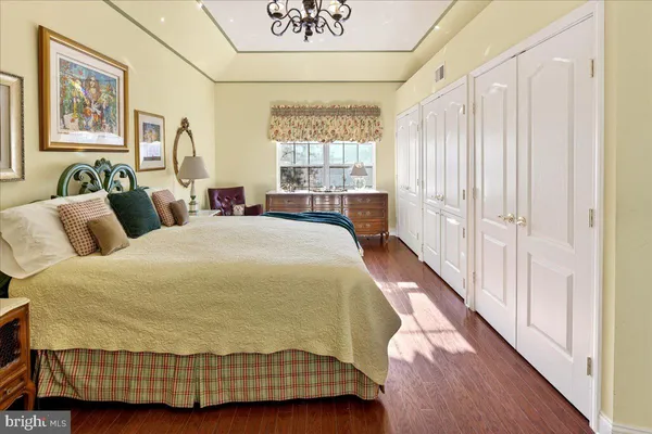 a spacious bedroom with a bed and window