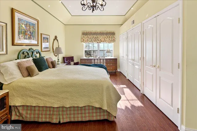 a spacious bedroom with a bed and window