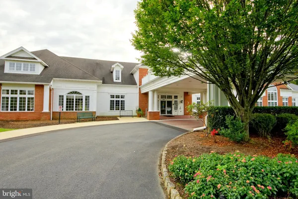 front view of a house with a garden