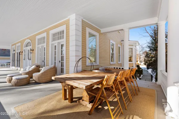a view of a patio with a table and chairs