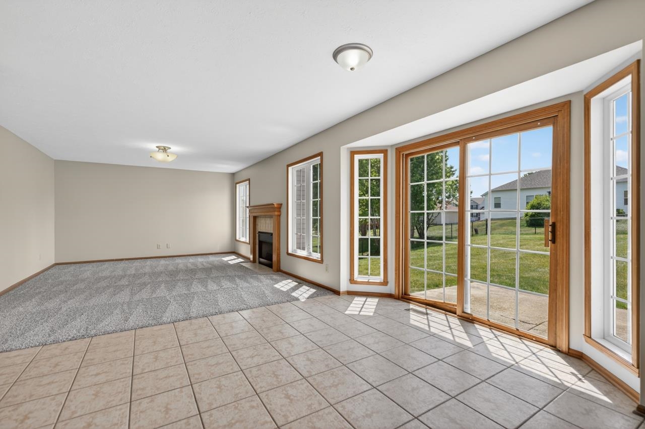 676 Elberon Way Roscoe, IL 61073 - Photo 13 of 30 a view of an empty room with windows