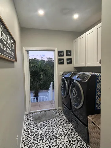 a view of a road with a house in the background