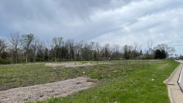 a view of street with tall buildings
