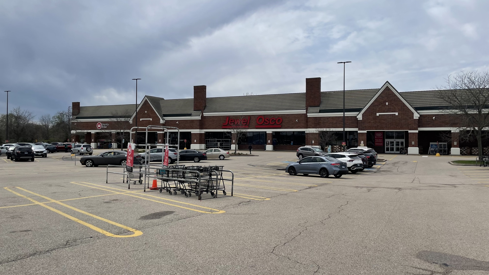 1601 Higgins Road Sleepy Hollow, IL 60118 - Photo 7 of 17 a car parked in front of a building