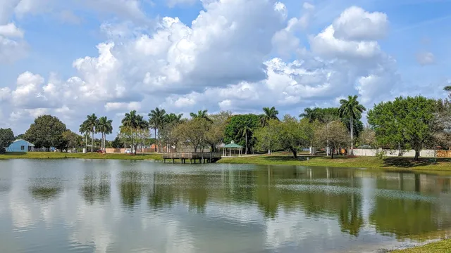 a backyard of a house with plants and outdoor seating