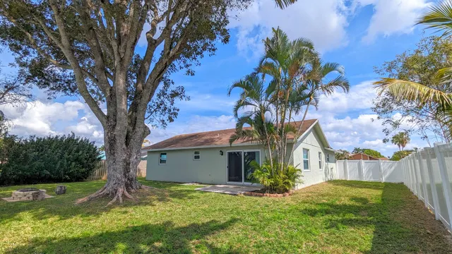 a backyard of a house with lots of green space