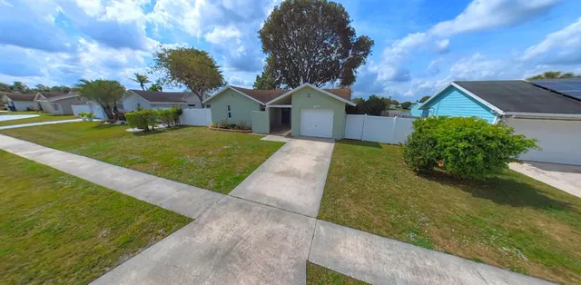 a view of a hallway with wooden floor and closet