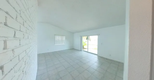 a bathroom with a shower and toilet
