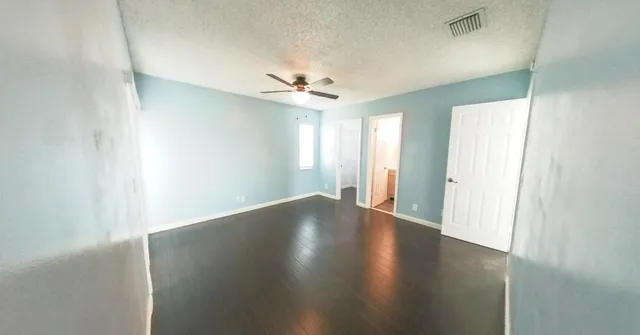 a view of a bathroom from a hallway