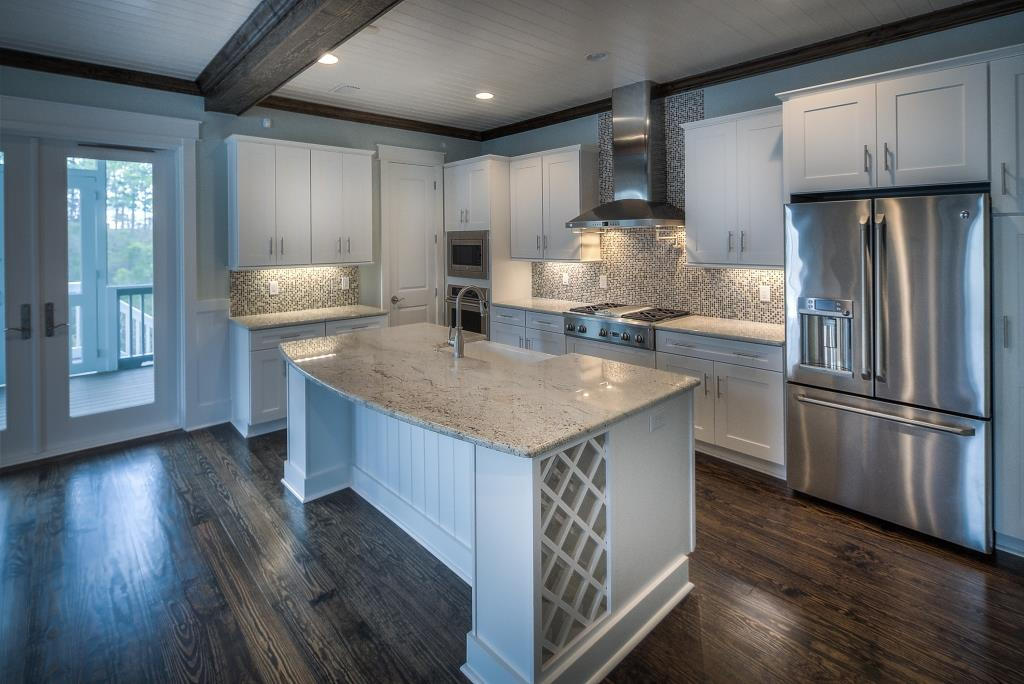107 Flatwoods Forest Loop Santa Rosa Beach, FL 32459 - Photo 6 of 21 a kitchen with stainless steel appliances granite countertop a refrigerator a sink dishwasher a stove and a microwave oven on granite countertops