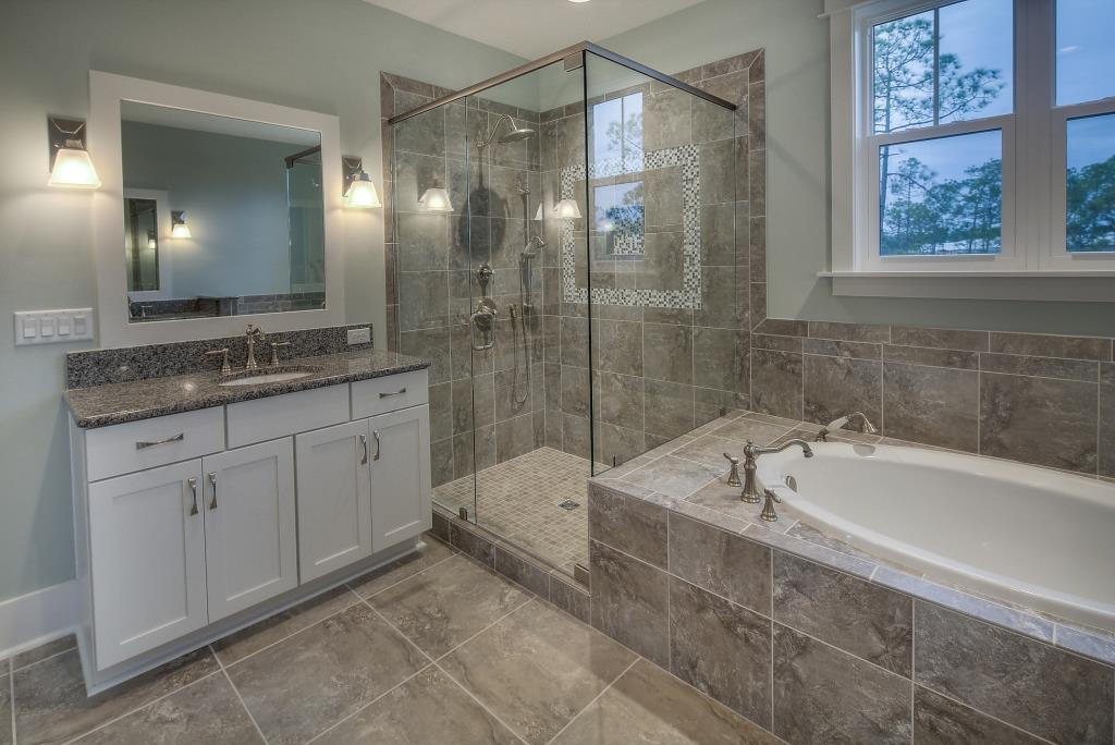 107 Flatwoods Forest Loop Santa Rosa Beach, FL 32459 - Photo 10 of 21 a bathroom with a tub sink and mirror