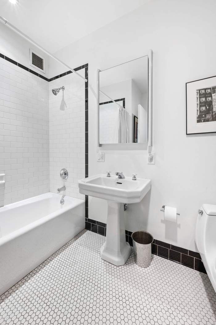 525 West 22nd Street, Unit 3AF Manhattan, NY 10011 - Photo 14 of 20 a bathroom with a sink a toilet and shower