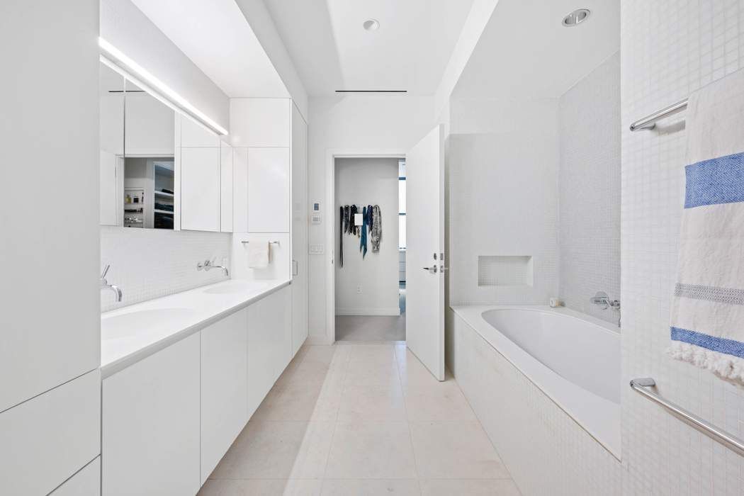 525 West 22nd Street, Unit 3AF Manhattan, NY 10011 - Photo 9 of 20 a bathroom with a bathtub and a sink