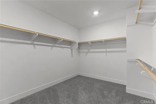 a view of an empty walk in closet