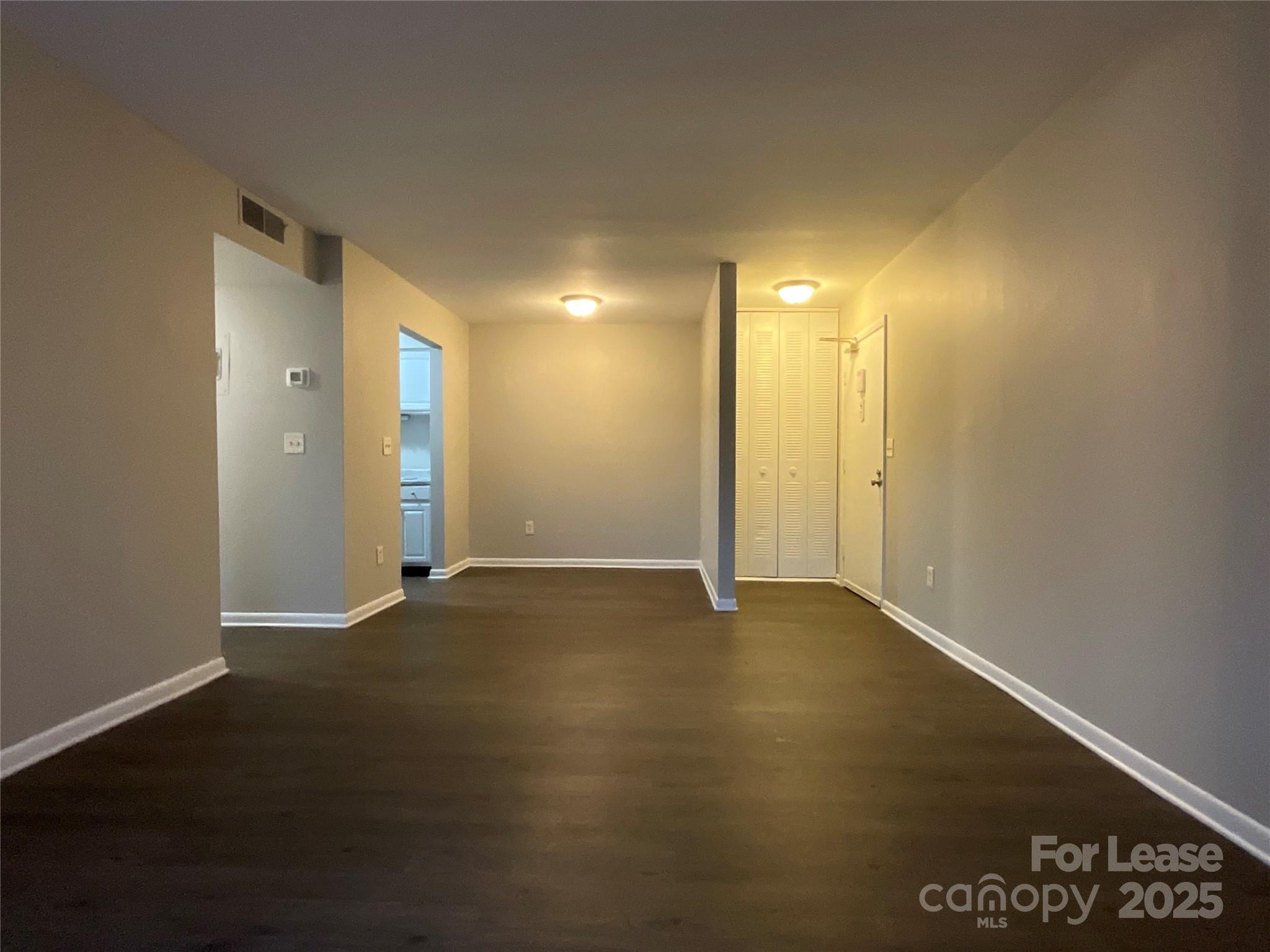 238 Orchard Trace Lane, Unit 2 Charlotte, NC 28213 - Photo 4 of 9 an empty room with a door