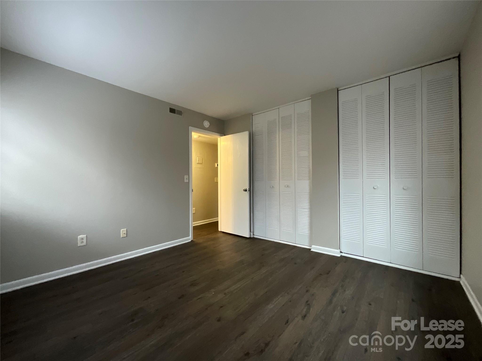 238 Orchard Trace Lane, Unit 2 Charlotte, NC 28213 - Photo 7 of 9 a view of an empty room with wooden floor