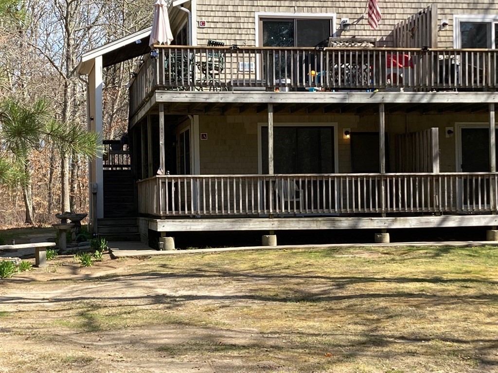 35 Ashumet Road, Unit 17A Mashpee, MA 02649 - Photo 2 of 8 a view of a house with a iron gate