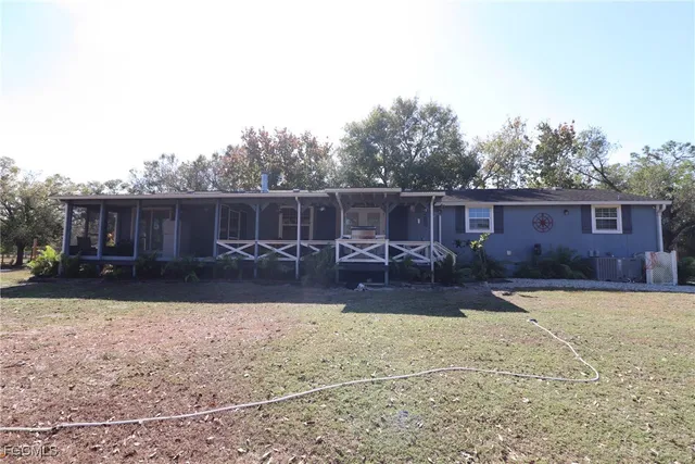 a view of a backyard with a patio