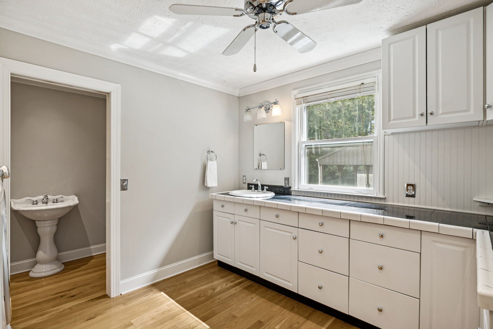 7144 Carter Road Fairview, TN 37062 - Photo 15 of 39 a spacious bathroom with a double vanity sink and a window