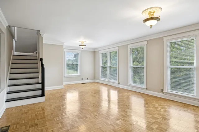 a view of an empty room with a window