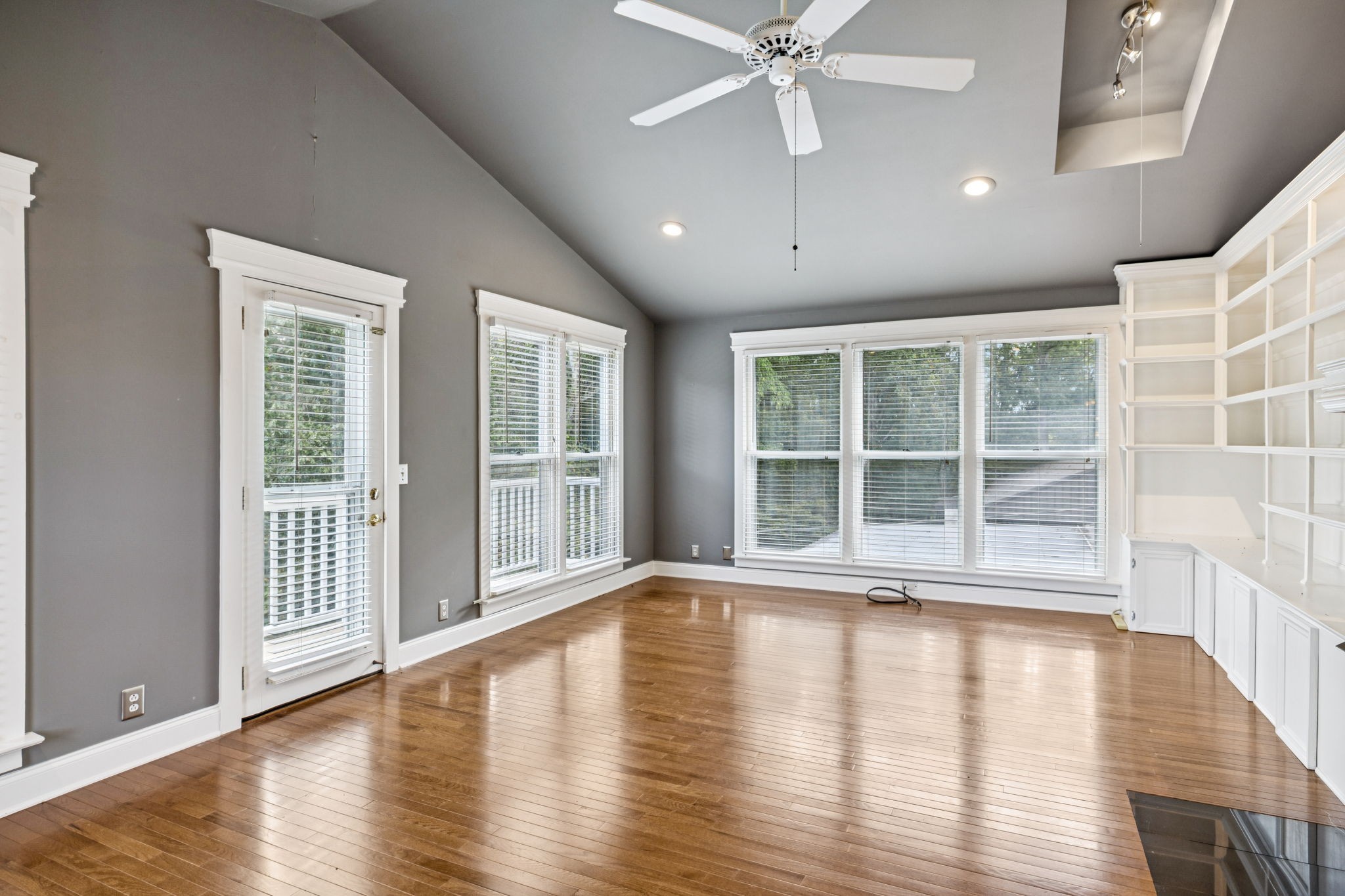7144 Carter Road Fairview, TN 37062 - Photo 26 of 39 a view of an empty room with wooden floor and a window