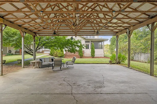 a view of balcony with wooden floor and fence