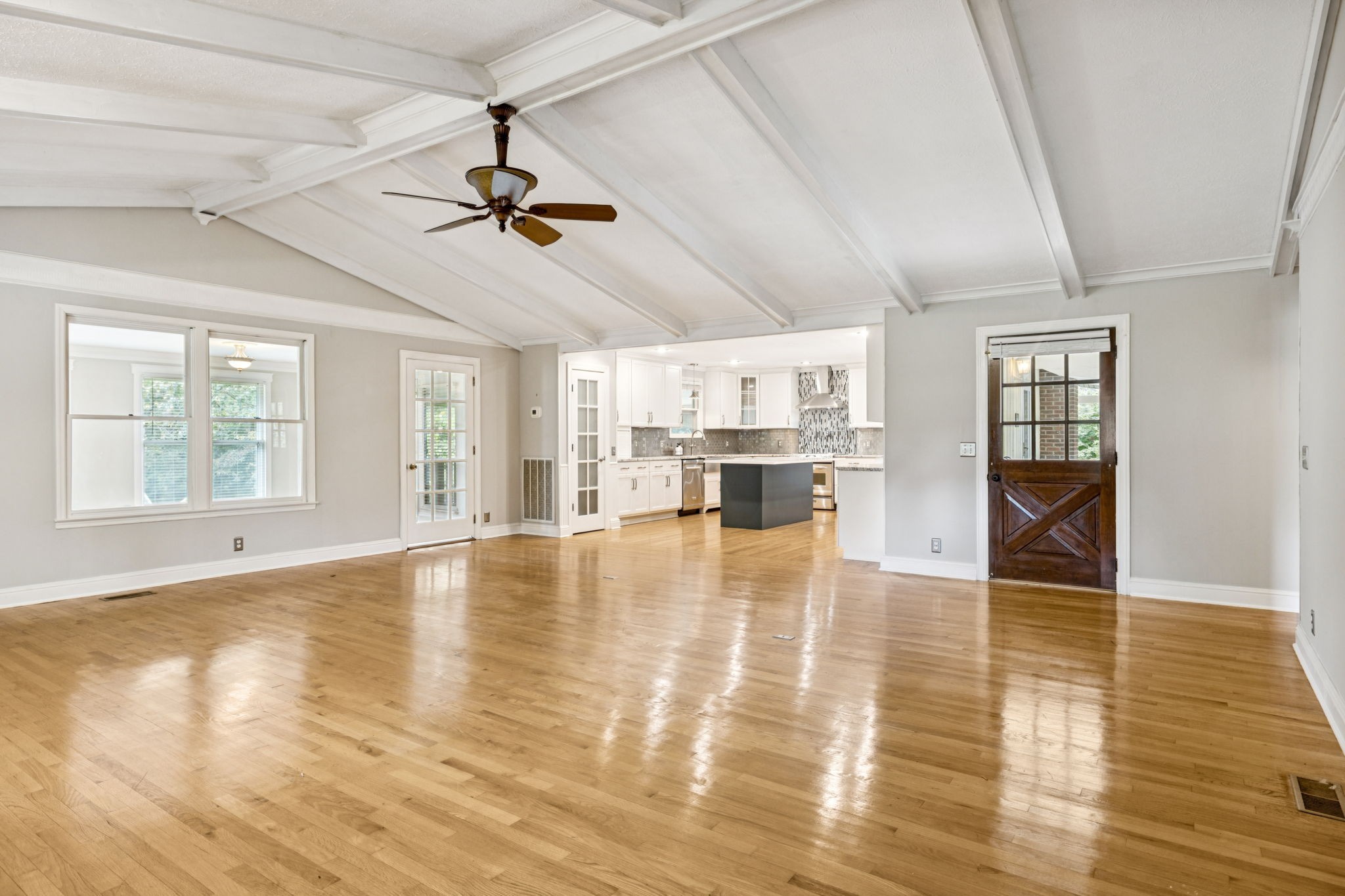7144 Carter Road Fairview, TN 37062 - Photo 6 of 39 a view of an empty room with window and wooden floor