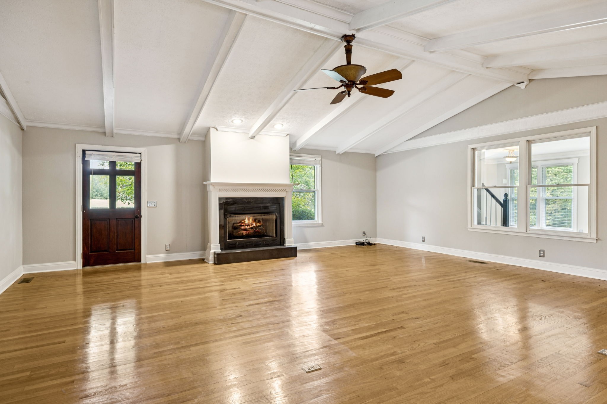 7144 Carter Road Fairview, TN 37062 - Photo 9 of 39 a view of empty room with wooden floor and fireplace