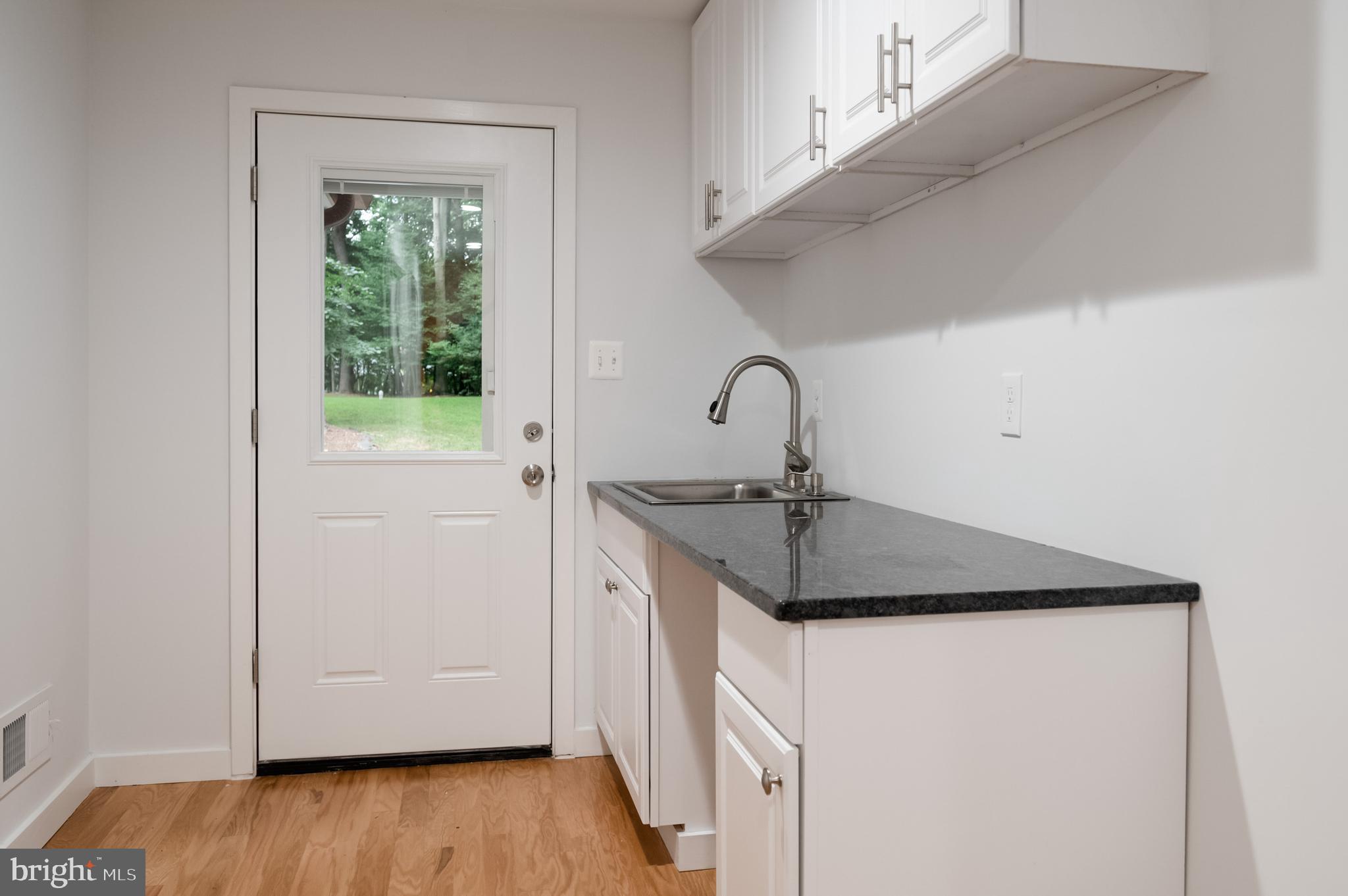 9501 Watts Road Great Falls, VA 22066 - Photo 53 of 73 Mud room with new floors granite counters and sink