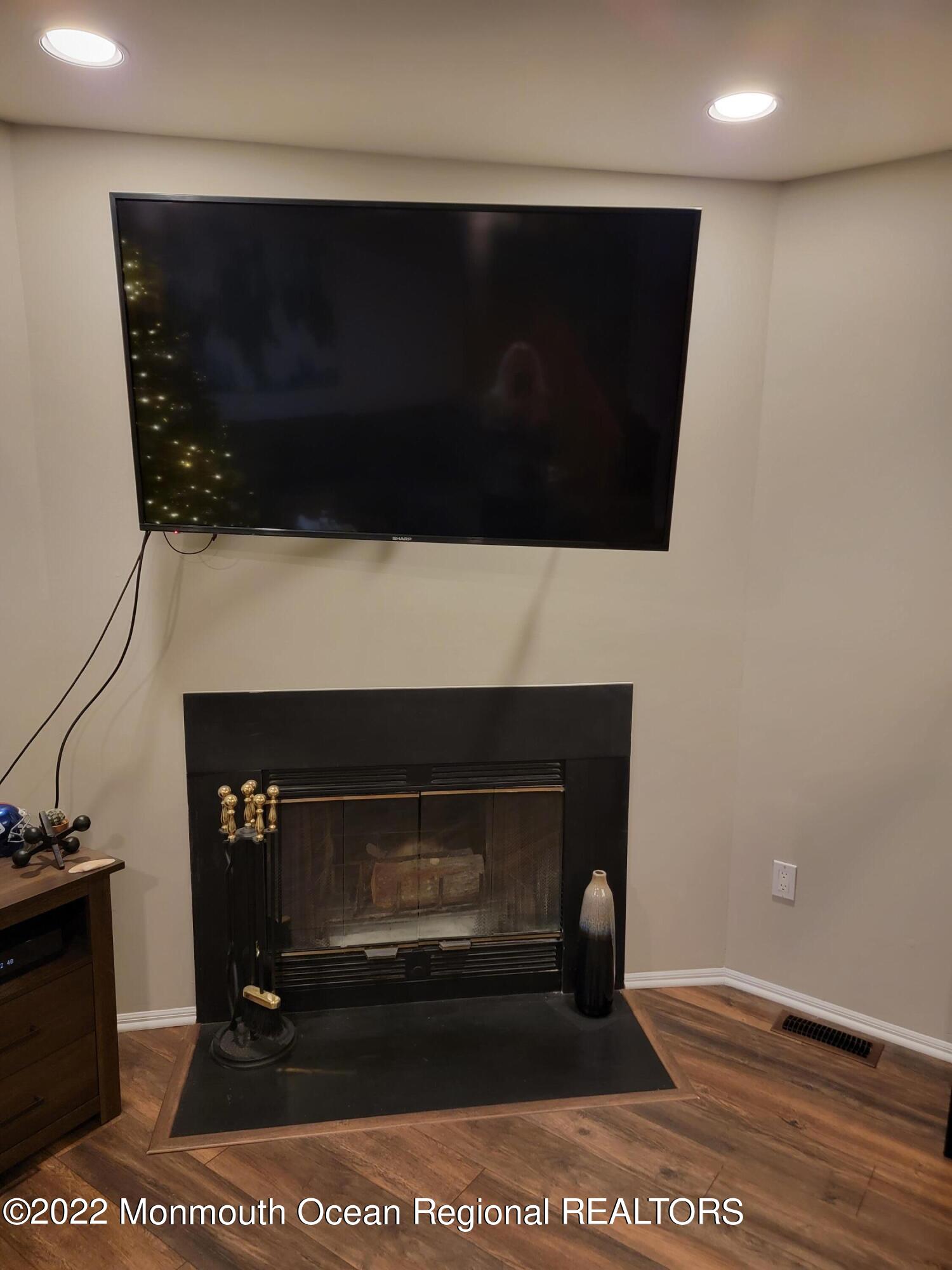 2208 Alpine Trail Neptune Township, NJ 07753 - Photo 8 of 20 a living room with a fireplace